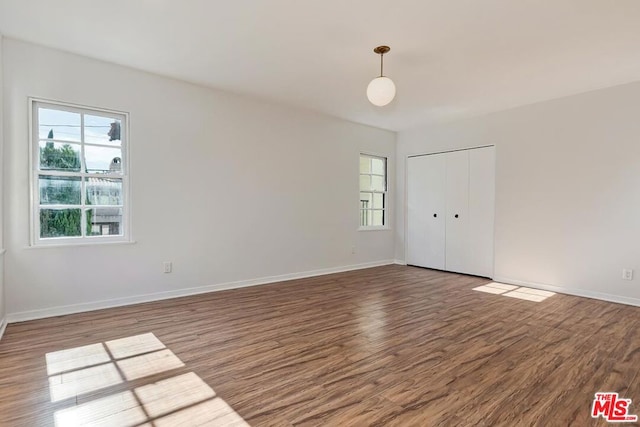 spare room featuring hardwood / wood-style flooring