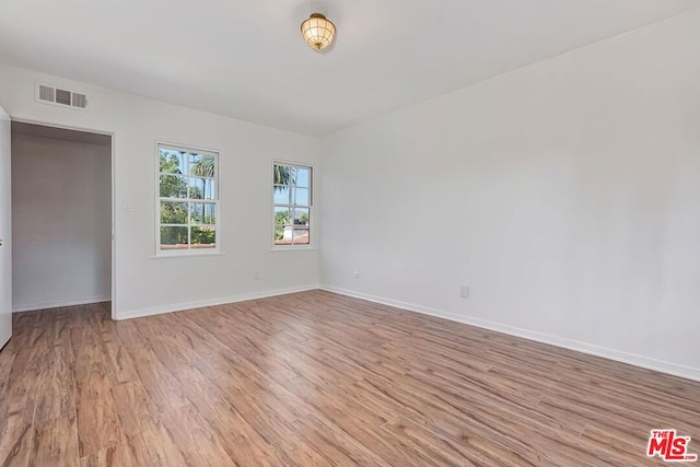 empty room with light wood-type flooring