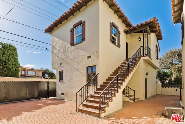 back of property with a patio area