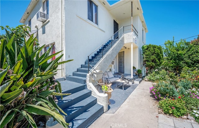 entrance to property featuring a patio area