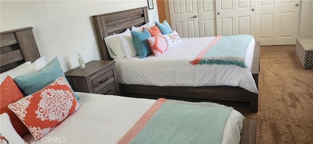 bedroom featuring a closet and carpet flooring