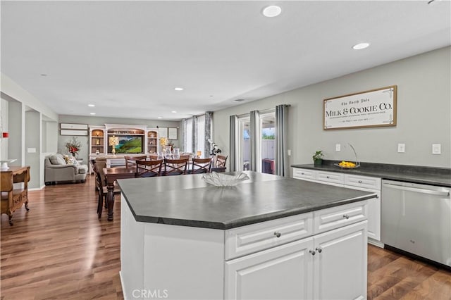 kitchen featuring dishwasher, a center island, white cabinets, and dark wood-type flooring