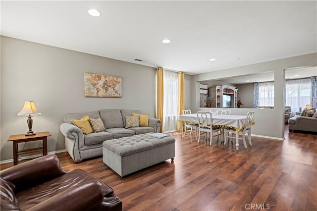 living room featuring dark wood-type flooring