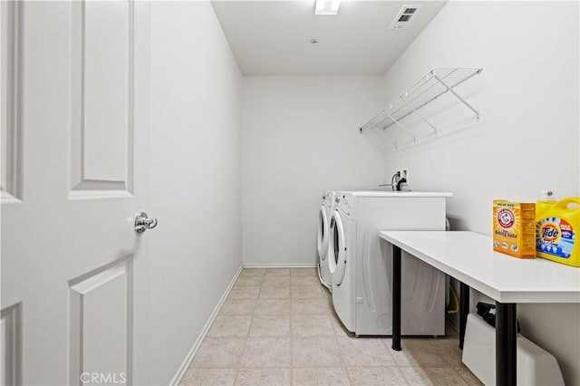 laundry area with washing machine and dryer