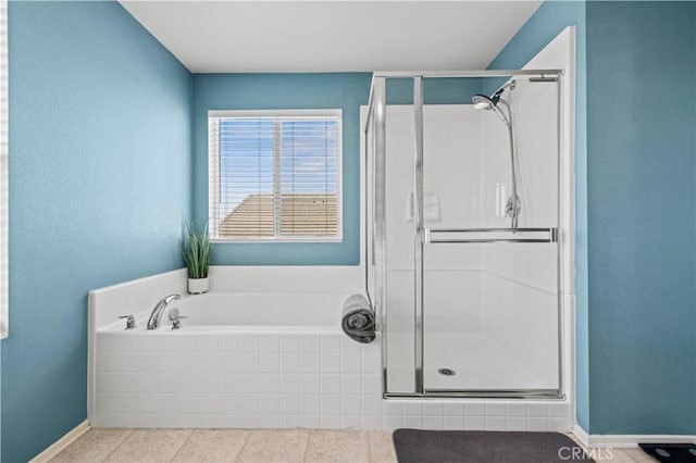 bathroom with tile patterned floors and separate shower and tub