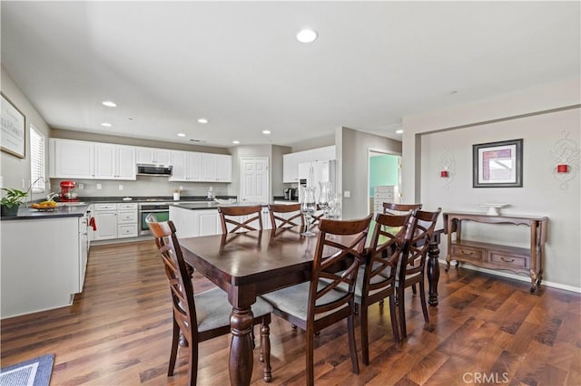 dining area featuring dark hardwood / wood-style floors