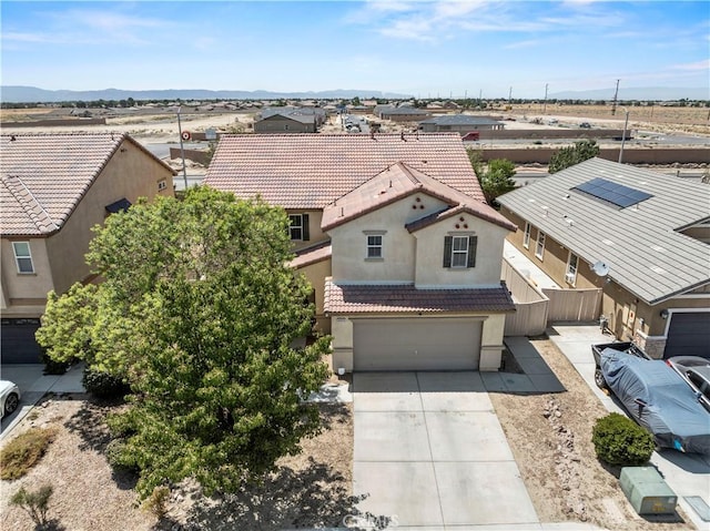 birds eye view of property featuring a mountain view