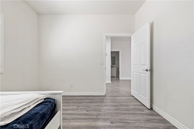 bedroom with light hardwood / wood-style floors