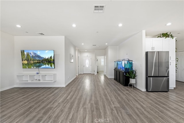 unfurnished living room featuring light hardwood / wood-style flooring