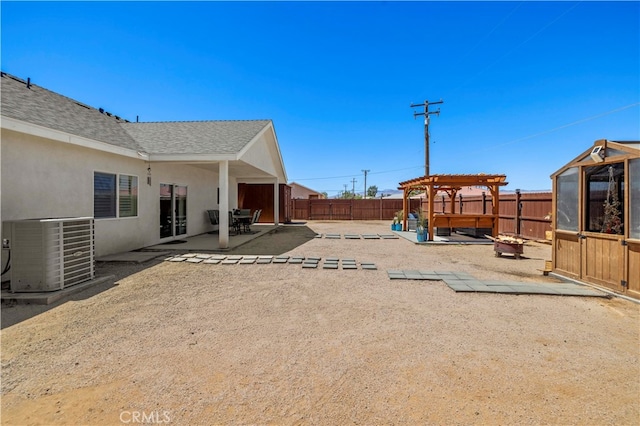 view of yard featuring a patio area and central air condition unit