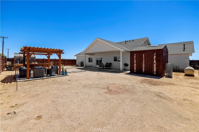 rear view of house with a pergola and a patio area