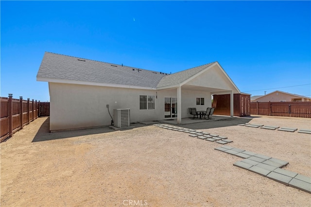 back of house with central AC unit and a patio area