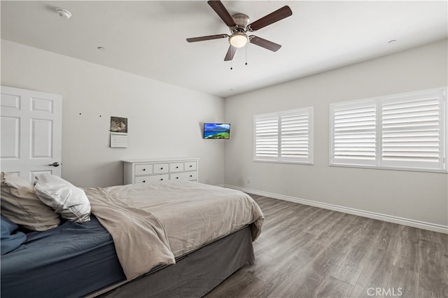 bedroom with light wood-type flooring and ceiling fan