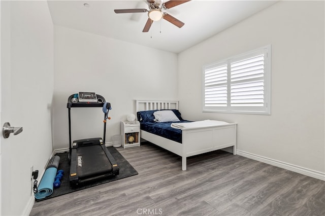 bedroom with hardwood / wood-style floors and ceiling fan