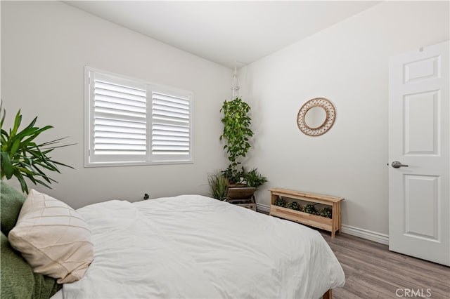 bedroom featuring hardwood / wood-style flooring