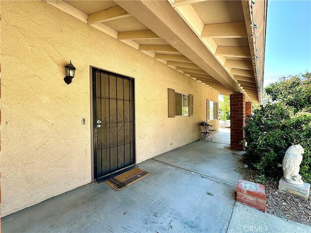 doorway to property featuring a patio