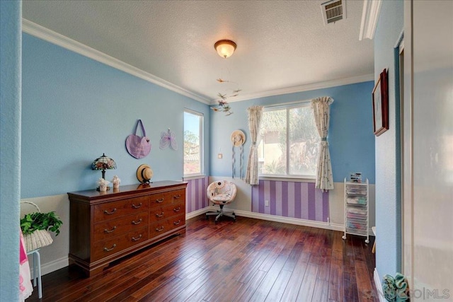 interior space featuring a textured ceiling, ornamental molding, and dark hardwood / wood-style flooring