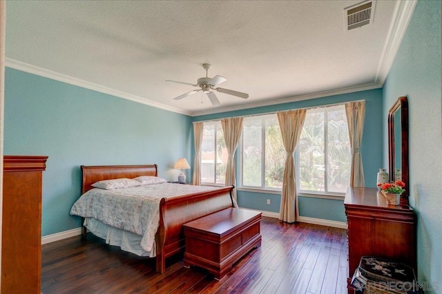 bedroom featuring a textured ceiling, ceiling fan, crown molding, and dark hardwood / wood-style flooring