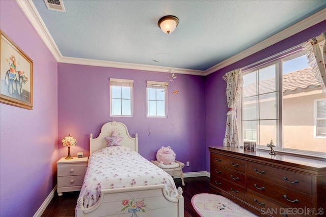 bedroom featuring ornamental molding, a textured ceiling, dark hardwood / wood-style flooring, and multiple windows