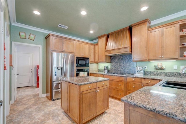 kitchen with a kitchen island, black appliances, crown molding, custom exhaust hood, and sink