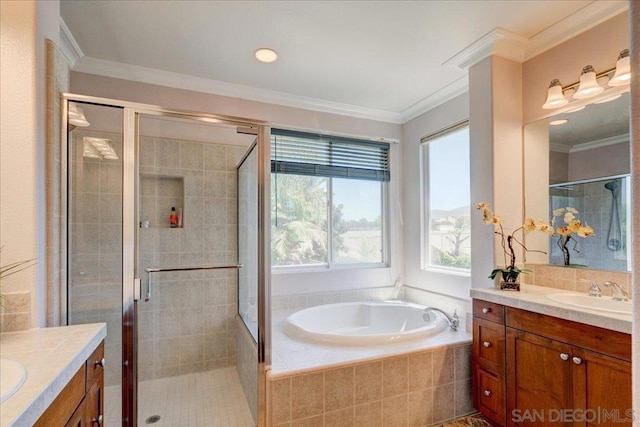 bathroom with vanity, crown molding, and separate shower and tub