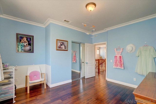 interior space featuring crown molding and dark hardwood / wood-style flooring