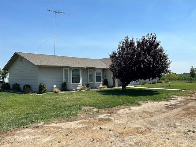 ranch-style home with a front yard