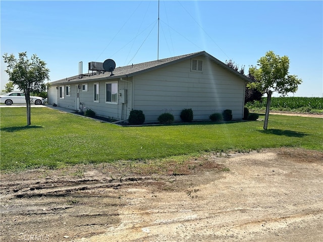 view of home's exterior featuring a yard