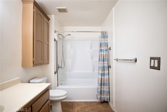 full bathroom with vanity, shower / bath combo with shower curtain, toilet, and tile patterned floors