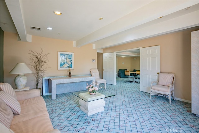 living room with beam ceiling