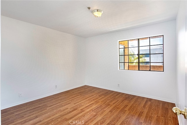 empty room featuring hardwood / wood-style flooring