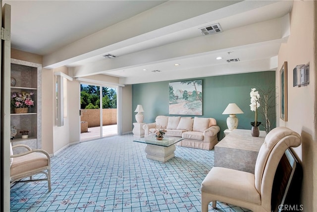 living room with beam ceiling