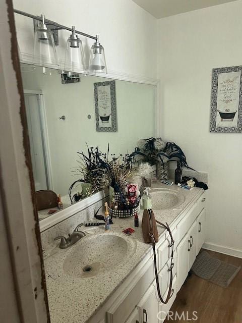 bathroom featuring vanity and wood-type flooring