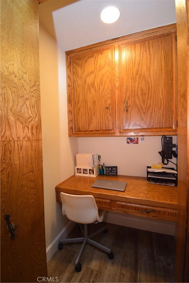 office featuring built in desk and wood-type flooring