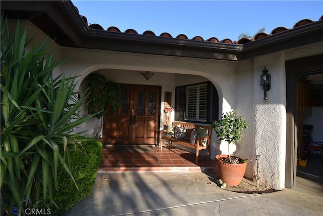 doorway to property featuring a porch