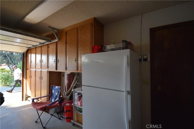 garage featuring white refrigerator