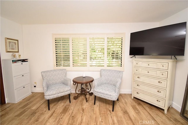 sitting room with light hardwood / wood-style flooring