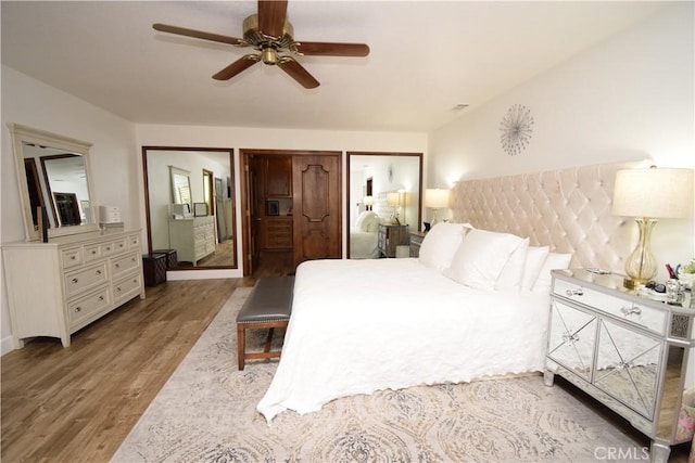 bedroom featuring light wood-type flooring and ceiling fan