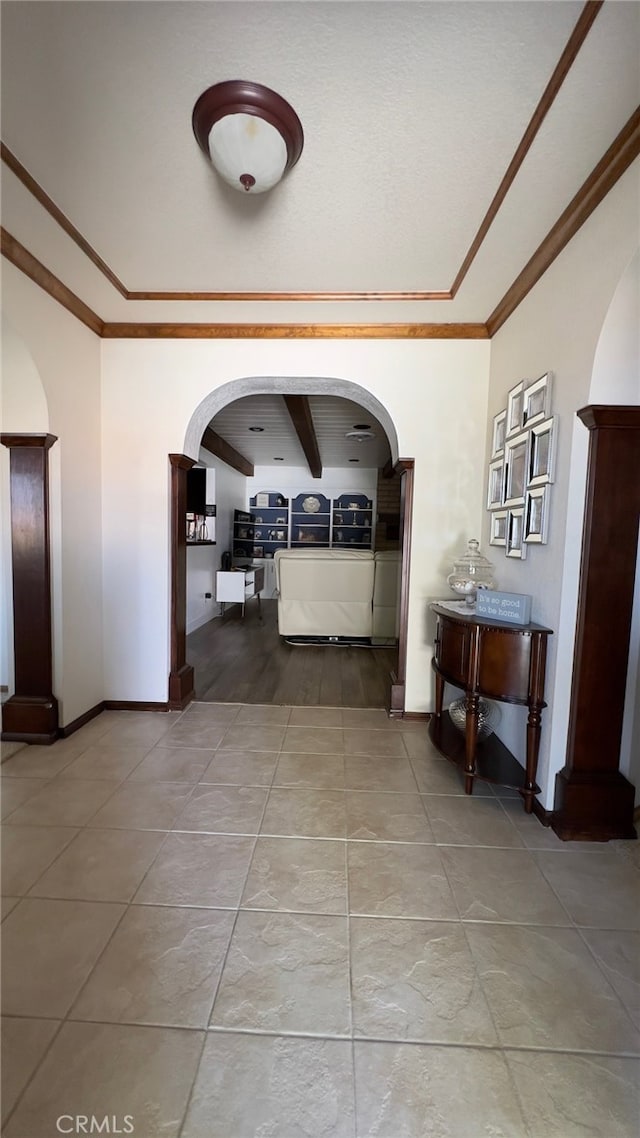 corridor featuring crown molding and tile patterned floors