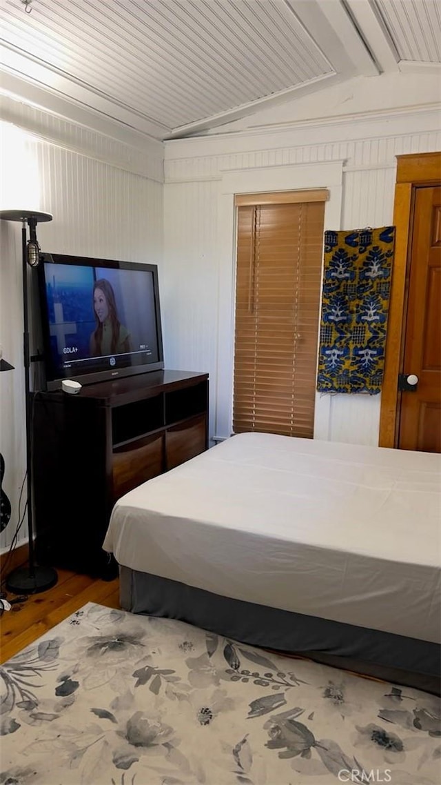 bedroom with wood-type flooring