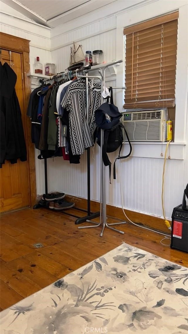 interior space with cooling unit and wood-type flooring