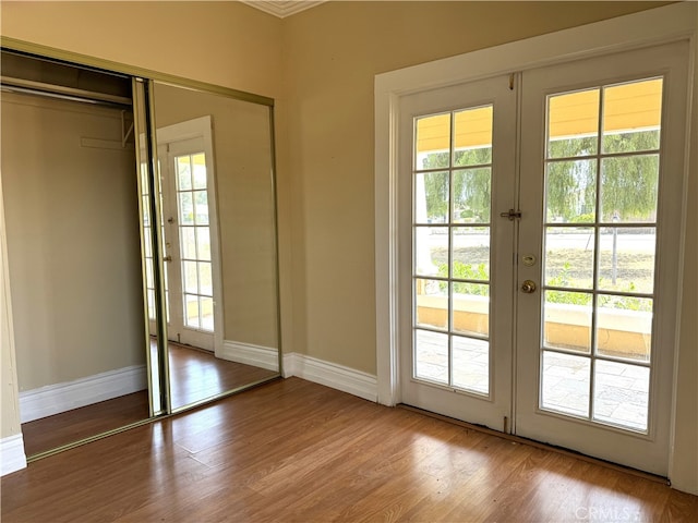 doorway to outside with light hardwood / wood-style flooring, plenty of natural light, and french doors