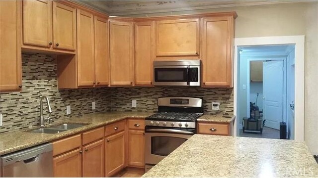 26759 Columbia St, Hemet, CA 92544 - kitchen featuring stainless steel appliances, decorative backsplash, and crown molding