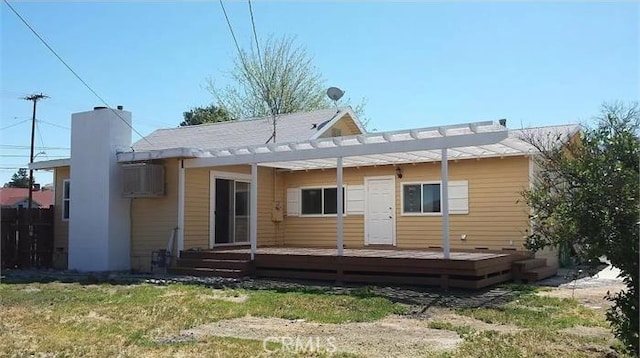 26759 Columbia St, Hemet, CA 92544 - rear view of house with a deck, a pergola, a chimney, and a wall mounted air conditioner