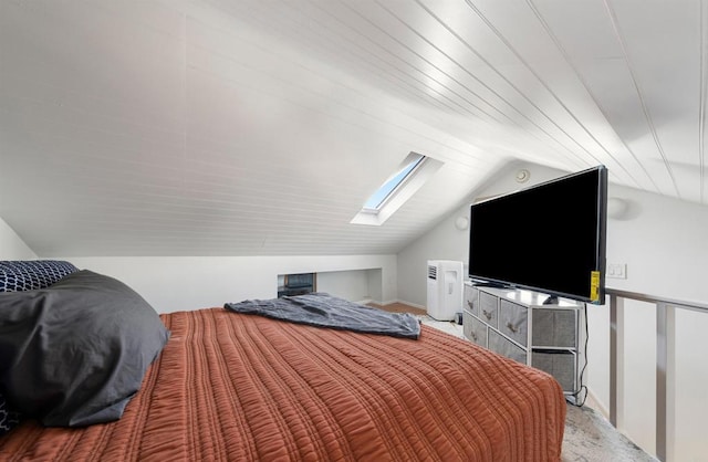 bedroom with lofted ceiling with skylight