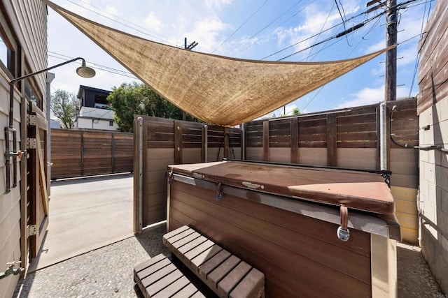 view of patio with a hot tub