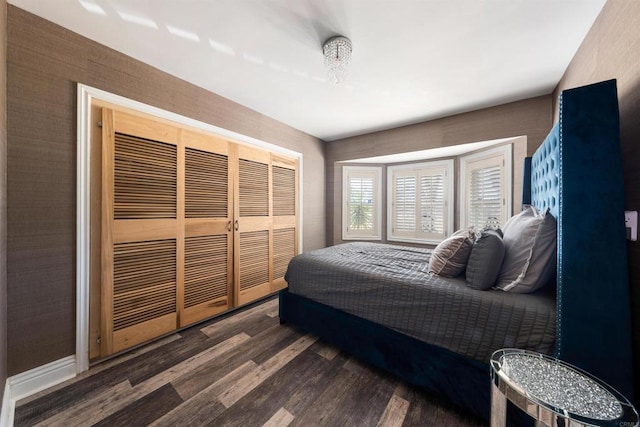 bedroom featuring dark hardwood / wood-style flooring