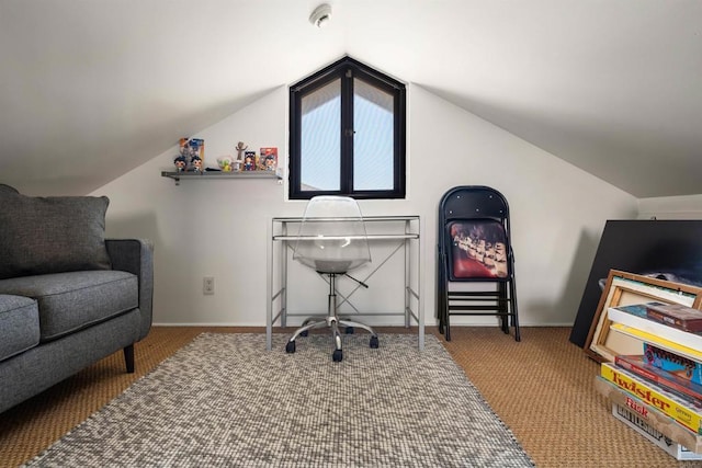 carpeted office with vaulted ceiling