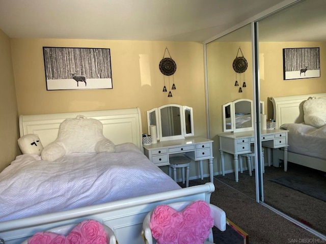 carpeted bedroom with a closet