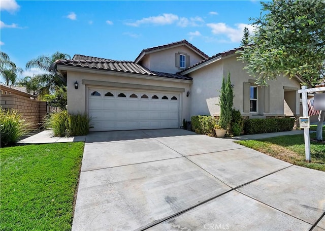 view of front of property with a garage and a front yard